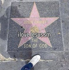 someone standing in front of a star that says i love jesusm the son of god