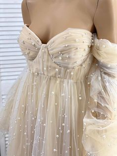 Evening Cream Tulle Dress, Cream Tulle Dress With Sweetheart Neckline, Fitted Cream Tulle Dress, Cream Tulle Dress With Fitted Bodice, Cream Tulle Gown For Party, Cream Party Gown For Summer, Beige Long Sleeve Dress For Wedding Night, Cream Summer Party Gown, Summer Party Cream Gown