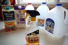 several bottles of cleaning products sitting on a counter