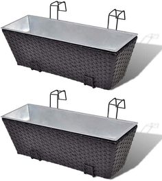 two black wicker tubs sitting next to each other on top of a white background