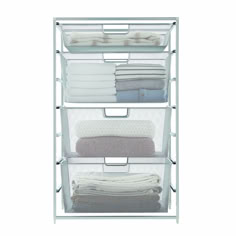 three tiered storage rack with folded towels and blankets on top, in front of a white background