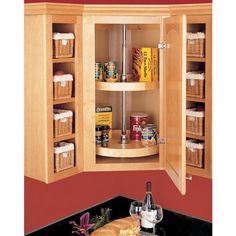 a kitchen cabinet with some food in it