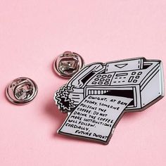 a pin with a drawing of a machine on it