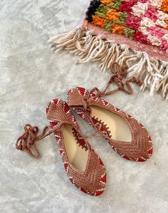 Hand crochet, ankle wrap shoes made by a woman's collective in  Southern India.  Cotton upper, leather lined, man made sole.  SIZE: 6-9 US fit true to size  please note: shoes you will receive have a  red poppy logo on the lining Bohemian Handwoven Closed Toe Sandals, Festive Bohemian Closed Toe Flats, Bohemian Flat Heel Huarache Sandals For Festival, Bohemian Lace-up Closed Toe Sandals With Adjustable Fit, Bohemian Lace-up Closed Toe Sandals Adjustable, Bohemian Lace-up Closed Toe Sandals, Bohemian Closed Toe Huarache Sandals, Bohemian Closed Toe Adjustable Lace-up Sandals, Bohemian Lace-up Sandals With Adjustable Round Toe