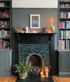 a living room with a fire place and bookshelves