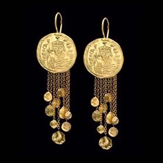 18k solid gold Antique coin top with mobile drops on chains earrings Weight: 9.7g (4.8g each earring) 18k Length: 6cm Width: 2cm All earrings have 18k solid gold secured ear wire, post and nuts. Free shipping! You are welcome to visit my shop for more of my designs: https://www.etsy.com/shop/GoldArtJewelry More earrings: https://www.etsy.com/shop/GoldArtJewelry?section_id=7573472 Please take a moment to read my shop policies before purchasing: https://www.etsy.com/shop/GoldArtJewelry/policy Foggy Moon, Byzantine Empress, Chandler Earrings, Historical Jewellery, Medieval Jewelry, Coin Earrings, Solid Gold Earrings, Ancient Jewelry, Coin Jewelry