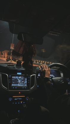 the interior of a car with dashboard lights on