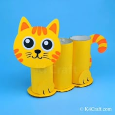 a paper mache of a cat with four cans