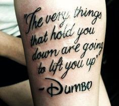 a tattoo saying the very things that hold you down are going to lift you up