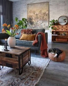 a living room filled with furniture and lots of flowers on top of a wooden table