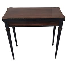 a small table with two legs and a drawer on one end, in dark wood