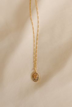 Honor the beauty and meaning of your birth flower with this dainty pendant. A keepsake that will never go out of style. Includes one 14k gold plated birth flower pedant with mother of Pearl background + 14k gold-filled figaro chain Pendant measures approx. 10x14mm Your choice of chain length (16", 18", 20" All materials are lead & nickel free Handmade with love by Luna & Jade in the U.S. January - Carnation: admiration, hope, love, rebirth, and remembrance. February - Iris: faith, hope, courage, January Carnation, Pearl Background, Poppy Necklace, Jewelry Design Studio, Permanent Jewelry, Handmade Gold Jewellery, Flower Collection, Necklaces Gold, Dainty Pendant