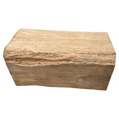 a piece of wood sitting on top of a white surface