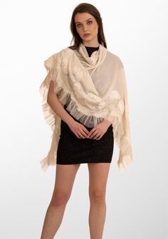 Indulge in the ultimate opulence with this ivory scarf woven from the finest cashmere. Wrap yourself in this statement piece elevated by its handcrafted tonal pearl-embroidered daisy flowers, exotic ivory lace panels and an ivory frill detailing on one side. This scarf brings with it a sense of timeless beauty, perfectly blending luxurious warmth and refined elegance. It is the ideal accessory to make heads turn on any formal evening out or a special occasion. Elegant Cashmere Shawl, Luxury Cream Silk Scarf, Elegant Embroidered Silk Shawl Scarf, Elegant Embroidered Silk Shawl, Elegant Cashmere Shawl Scarf, Wedding Cream Pashmina Shawl, White Pashmina Scarves For Weddings, Elegant Cream Pashmina Shawl, Elegant Embroidered Pashmina Scarves