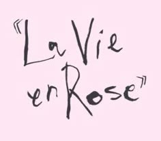 the words la vie en rose written in black ink