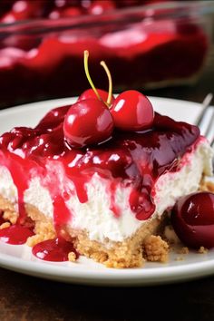 a piece of cheesecake with cherries on top