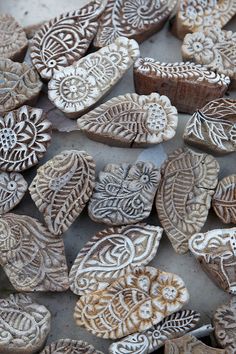 some very pretty wooden hearts with designs on them