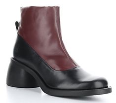 Crafted in durable leather, this two-tone boot bolsters your step with a comfy insole and a stable block heel. From Fly London. Calf Leather Boots With Contrasting Block Heel, Modern Leather Boots With Block Heel, Modern Leather Boots With Contrasting Heel Counter, Leather Boots With Contrasting Heel Counter And Square Toe, Modern Leather Boots With Contrasting Heel, Leather Platform Boots With Rubber Block Heel, Leather Boots With Square Toe And Contrasting Heel, Leather Workwear Boots With Contrasting Heel Counter, Two Tone Boots