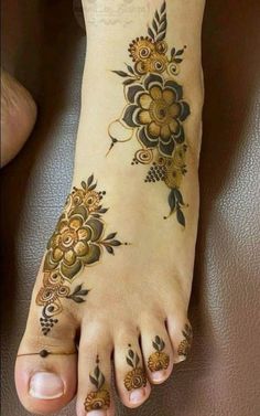 the foot is decorated with flowers and leaves