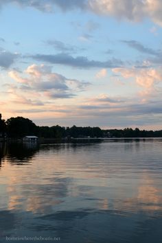 the sky is reflected in the calm water