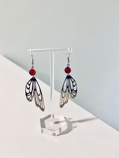 Metal earrings which look like butterfly wings! The stone is red and semi-translucent. Extremely light and suitable for all sorts of occasions. Butterfly Wing Earrings, Butterfly Wing, Butterfly Jewelry, Wing Earrings, Wedding Jewelry Earrings, Metal Earrings, Butterfly Wings, Wedding Earrings, Wedding Jewelry