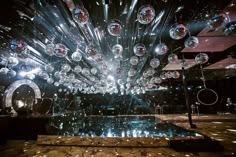 a large room filled with lots of disco balls