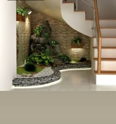 an indoor area with stairs, plants and rocks