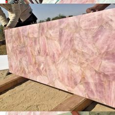 pink marble is being laid out on the ground and ready to be used as wallpaper