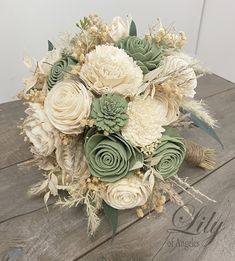 a bridal bouquet with white and green flowers