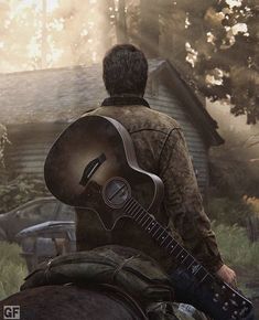 a man sitting on the back of a horse holding a guitar in front of a house