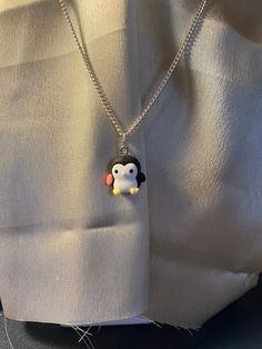 Fun Penguin necklace for the animal lover in your house. This makes a perfect Christmas gift or stocking stuffer. I have to admit I e always found it odd that an animal from the South Pole is synonymous with Santa, who lives in the North Pole.  This beautiful and fun necklace is made with an 18 inch, stainless steel chain.  If you're looking for something a little kitsch then this necklace is perfect. Penguin Necklace, Happy Holiday Gifts, Pole Nord, Tie Shoelaces, Happy Holiday, Christmas Gift Jewelry, Cool Necklaces, South Pole, North Pole