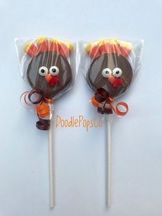 two chocolate lollipops decorated to look like a turkey