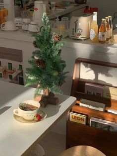 a small christmas tree sitting on top of a table