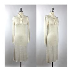 "Vintage Ecru Ivory Cream Knit Acrylic Crochet Neckline Buttoned Keyhole Neckline Not Lined Long Sleeve Midi M Medium 70s Stretchy Sheer A Line Fitted Sweater Dress There is no label  Closure : buttons ❖ Measurements ❖  Bust : 36 \" Waist : 30 \"  Hips : 40 \" Length : 44 \" Sleeve : 22 \" Shown on the dress form size 6 ( Bust : 34 \" , Waist   : 25 \" , Hips : 35 \" ) ❖ Fabric ❖ Acrylic ❖ Condition ❖  Great vintage condition. Please zoom in photos. C30" Fitted Long Sleeve Cream Vintage Dress, Long Sleeve Cream Vintage Dress, Retro Cream Long Sleeve Vintage Dress, Fitted Sweater Dress, White Vintage Long-sleeve Dress With Lace Trim, 1970s Cream Fitted Dress, Crochet Neckline, Vintage Black Dress, Keyhole Neckline