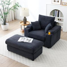 a blue chair and ottoman in a living room with white rugs on the floor