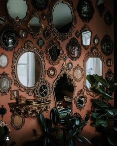 there are many mirrors on the wall in this room