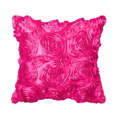 a pink pillow with roses on it