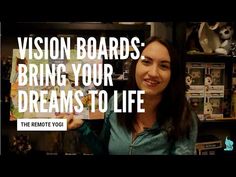 a woman holding up a book with the words vision boards bring your dreams to life