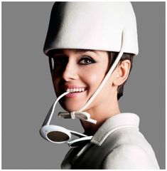 a woman wearing a white hat and eye glasses on the cover of magazine b - alli