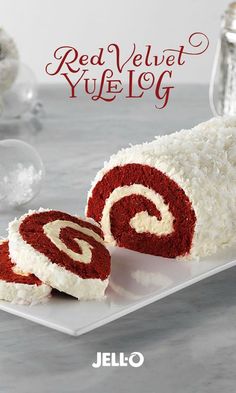 red velvet yule log on a white plate