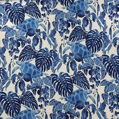 a blue and white wallpaper with large leaves in the middle, on top of it