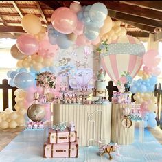 a baby shower party with balloons and decorations