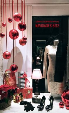 an assortment of christmas decorations and shoes on display