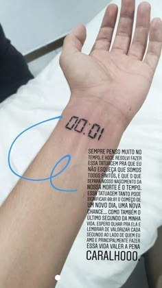 a person's arm with a wrist tattoo that has the number eleven on it