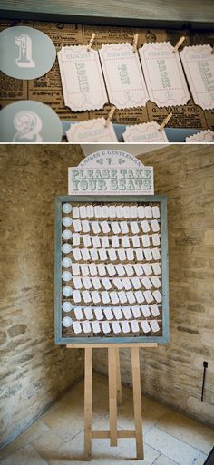 a wooden sign sitting on top of a floor next to a wall filled with signs