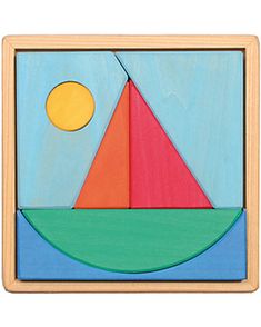 a wooden puzzle with a sailboat and sun in the sky on it's side