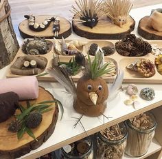 a table topped with lots of wooden slices covered in different types of food and decorations