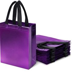 a purple bag and stack of black bags