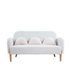 a white couch with four pillows on it's back and legs, against a white background