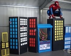 an indoor play area for children with spiderman on top and blocks in the middle